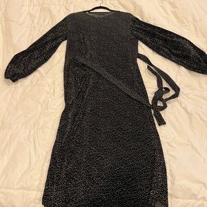 Black Zara dress with tiny white polka dots. Wrap dress. Size medium .